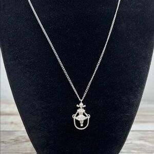 silver-tone Sarah Coventry "Skip" pendant necklace from 1976